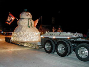 17 foot snowman on the Noble Construction float.
