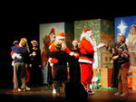 Santa dances with members of the audience