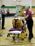 A victim is moved to the medical station.