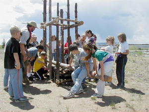 Members of the American Mountain Men demonstrate a beaver pelt press to area school children last year.