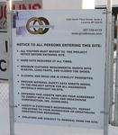 Sign on fence at entry into construction area