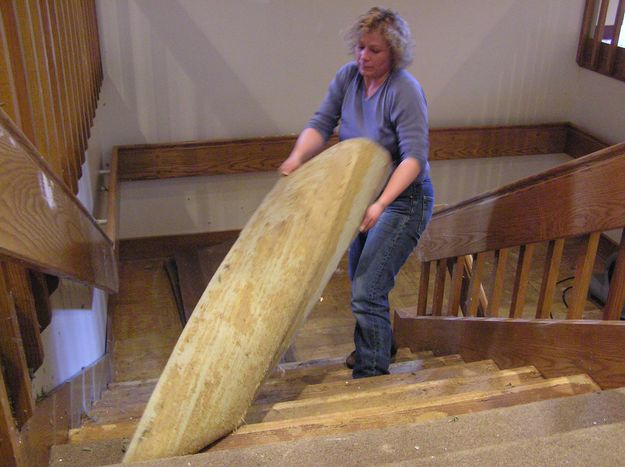 Tearing out carpet. Photo by Pinedale Online.