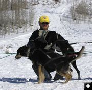 Holding the dogs. Photo by Dawn Ballou, Pinedale Online.