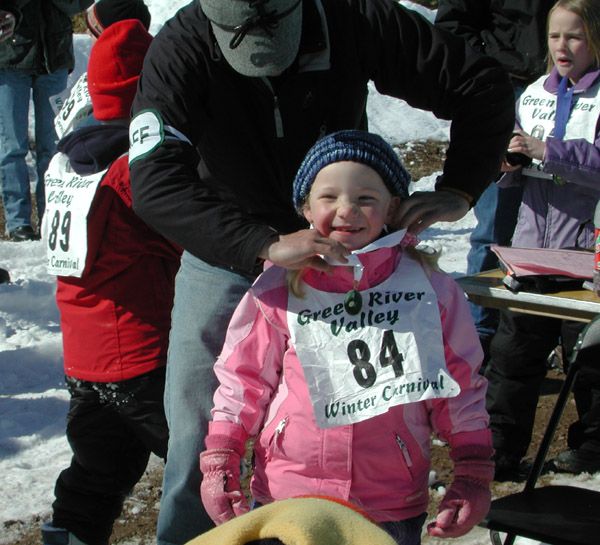 Getting her medal. Photo by Pinedale Online.