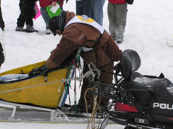 Securing the sled. Photo by Dawn Ballou, Pinedale Online.