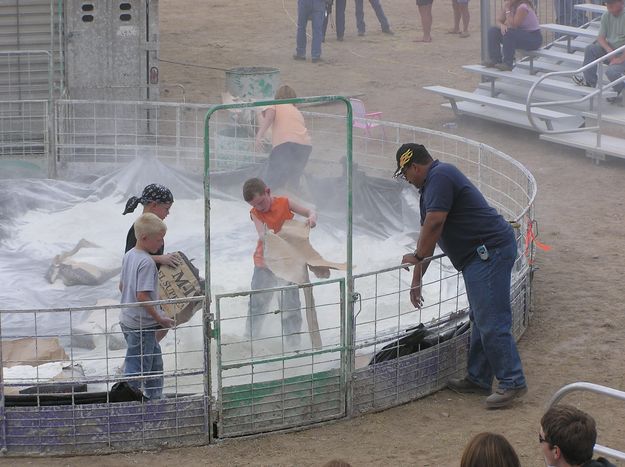 Spreading the clay. Photo by Dawn Ballou, Pinedale Online.