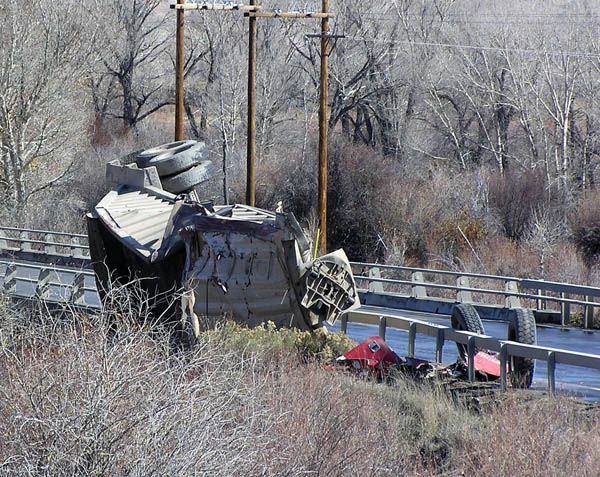 Belly dump on bridge railing. Photo by Dawn Ballou, Pinedale Online.