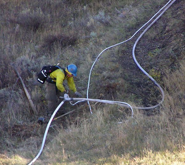 Checking the hoses. Photo by Dawn Ballou, Pinedale Online.