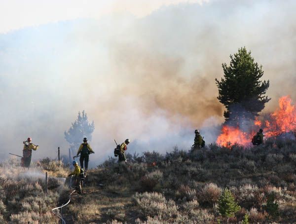 Putting in the burn buffer. Photo by Clint Gilchrist, Pinedale Online.