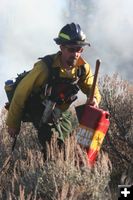 Moving gas cans. Photo by Clint Gilchrist, Pinedale Online.