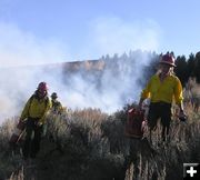 Moving fuel cans. Photo by Dawn Ballou, Pinedale Online.