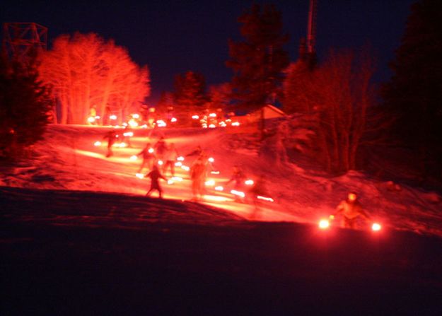 Night Skiing by torchlight. Photo by Fred Pflughoft.