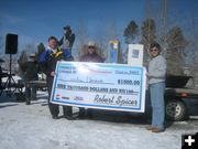 Curtis Hendricks $1000 Check. Photo by Bill Boender.