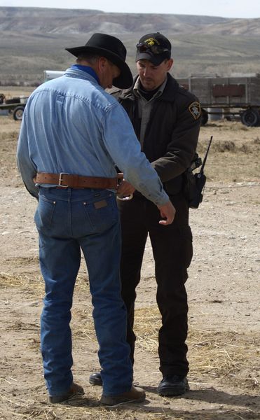 Handcuffing. Photo by Cat Urbigkit, Pinedale Online.