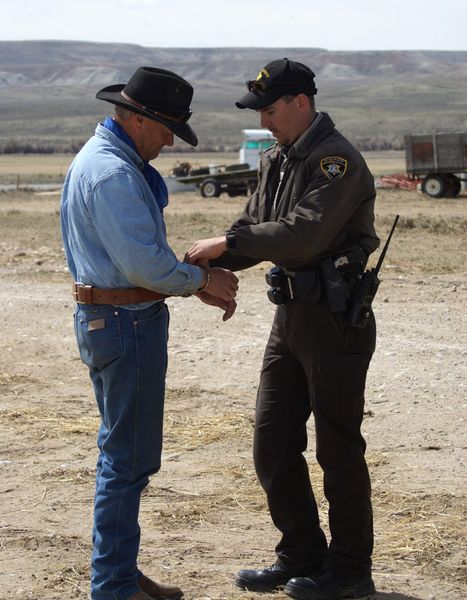 Getting cuffed. Photo by Cat Urbigkit, Pinedale Online.