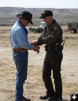 Getting cuffed. Photo by Cat Urbigkit, Pinedale Online.