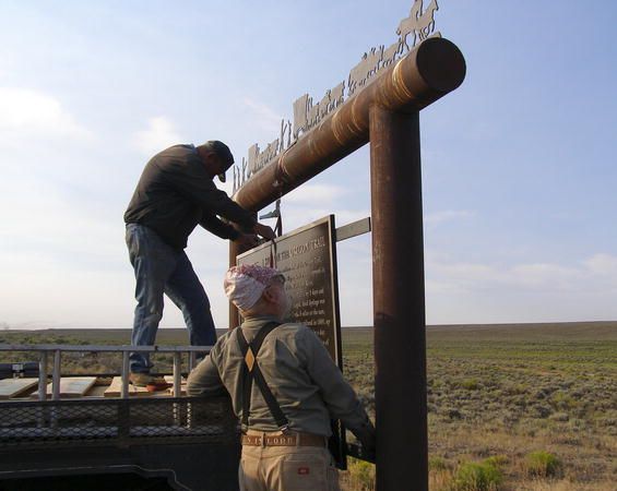 Installing the new sign. Photo by Sublette County Museum Board.