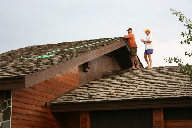 Watering down the Museum roof. Photo by Clint Gilchrist, Pinedale Online.