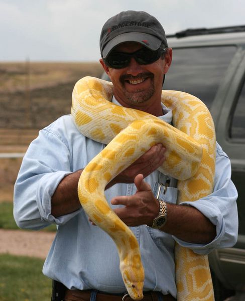 Holding the Snake. Photo by Dawn Ballou, Pinedale Online.