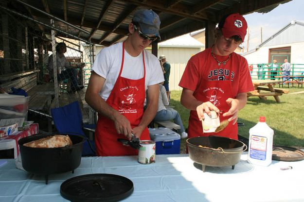Nathan and Austin cooking. Photo by Dawn Ballou, Pinedale Online.