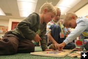 Doing Puzzles. Photo by Pam McCulloch .