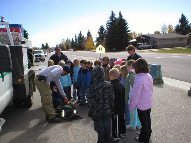 Lifting the heavy pack. Photo by Bridger-Teton National Forest.