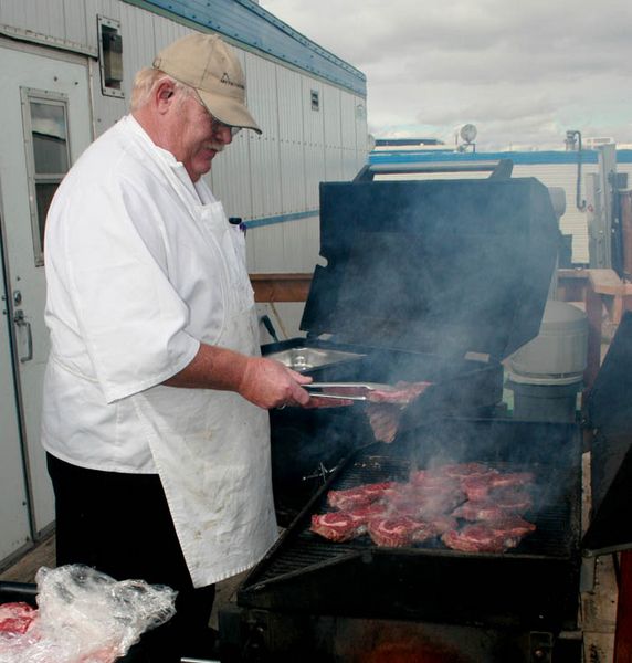Rollie cooking steaks. Photo by Dawn Ballou, Pinedale Online.