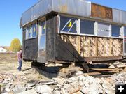 Removing siding. Photo by Cheryl and Vince Pierce.