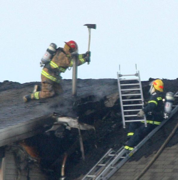 Chopping into the roof. Photo by Clint Gilchrist, Pinedale Online.