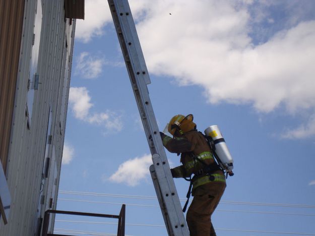 Climbing the ladder. Photo by Sublette County Fire Board.