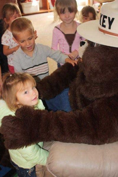 Happy kids with Smokey Bear. Photo by US Forest Service.