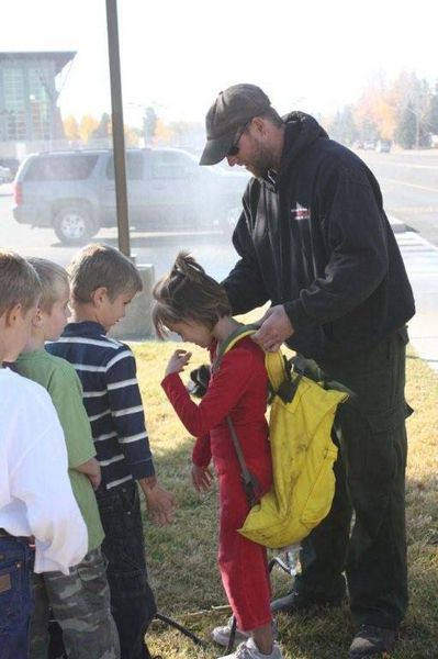 Wearing the backpack. Photo by US Forest Service.