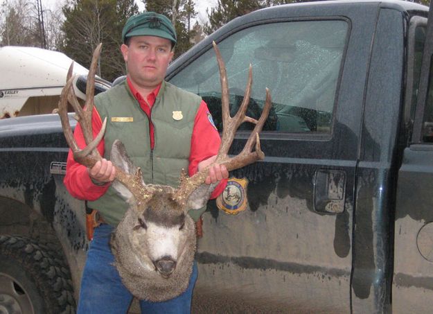 Brian Nesvik with poached deer. Photo by WGFD.