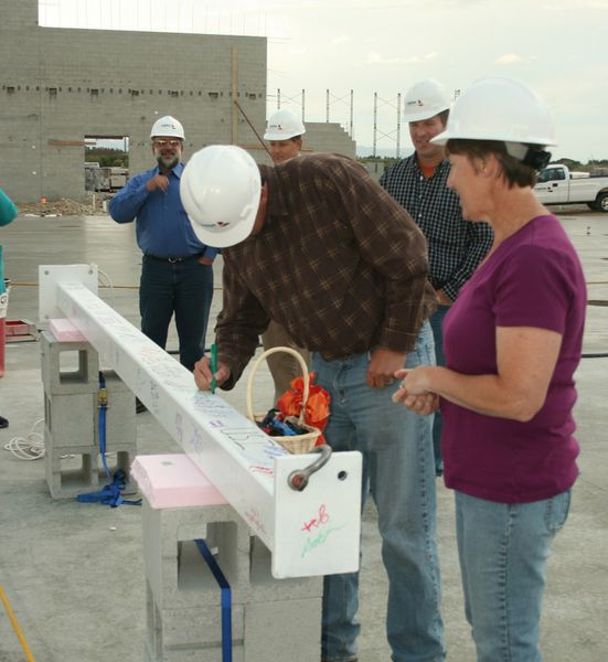 Signing. Photo by Dawn Ballou, Pinedale Online.