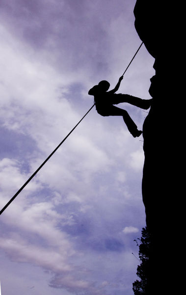 Repelling. Photo by Mark Gocke, Wyoming Game & Fish Department.