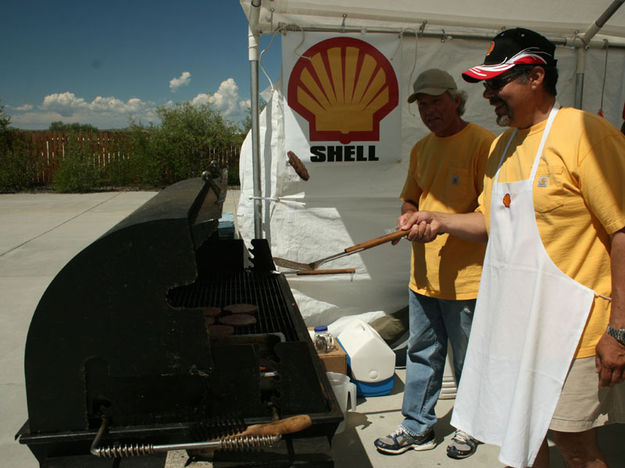 Flipping burgers. Photo by Dawn Ballou, Pinedale Online.