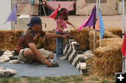 Stacking Bricks. Photo by Dawn Ballou, Pinedale Online.