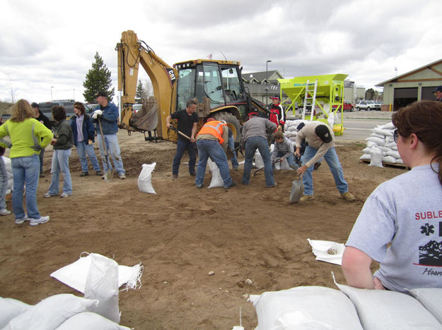 Filling sand bags. Photo by Bill Winney.