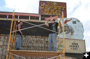 Removing boards. Photo by Dawn Ballou, Pinedale Online.