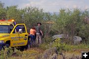 Car meets watery end on 191. Photo by Megan Rawlins, Pinedale Roundup\.