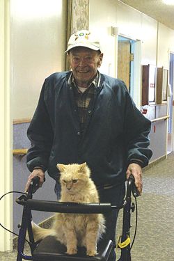 Roy Snow and 'Lucky' cat. Photo by Sam Luvisi, Sublette Examiner.