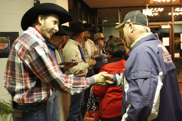 Signing autographs. Photo by Tim Ruland, Pinedale Fine Arts Council.