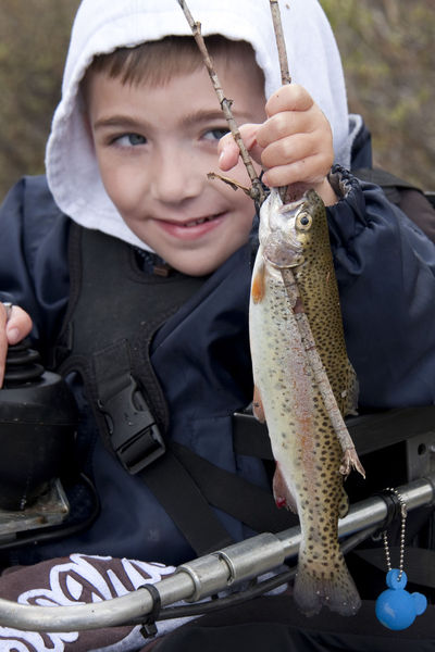 Aiden Rhea and his fish. Photo by Mark Gocke, Wyoming Game & Fish.