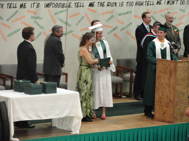 Christina Silvey gets her diploma. Photo by Bob Rule, KPIN 101.1 FM Radio.