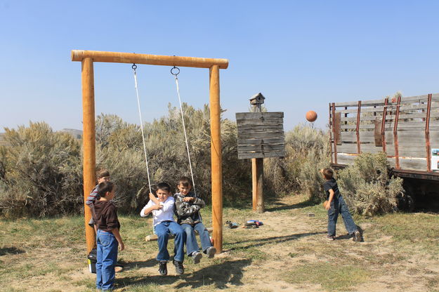 Swinging and shooting hoops. Photo by Dawn Ballou, Pinedale Online.