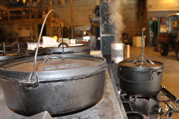 Prepare pots and coals. Photo by Dawn Ballou, Pinedale Online.