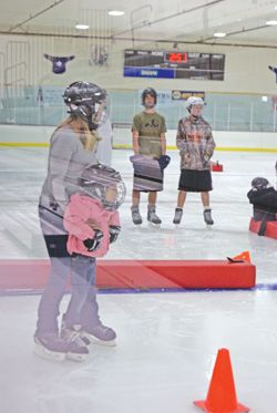 Exploring hockey on ice. Photo by Megan Neher, Sublette Examiner.