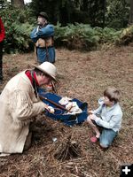 Starting a fire. Photo by Sublette County Historical Society.