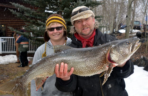 Proud Dad holds Sons Fish. Photo by Terry Allen.