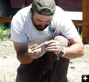 Examining chunk. Photo by Dawn Ballou, Pinedale Online.